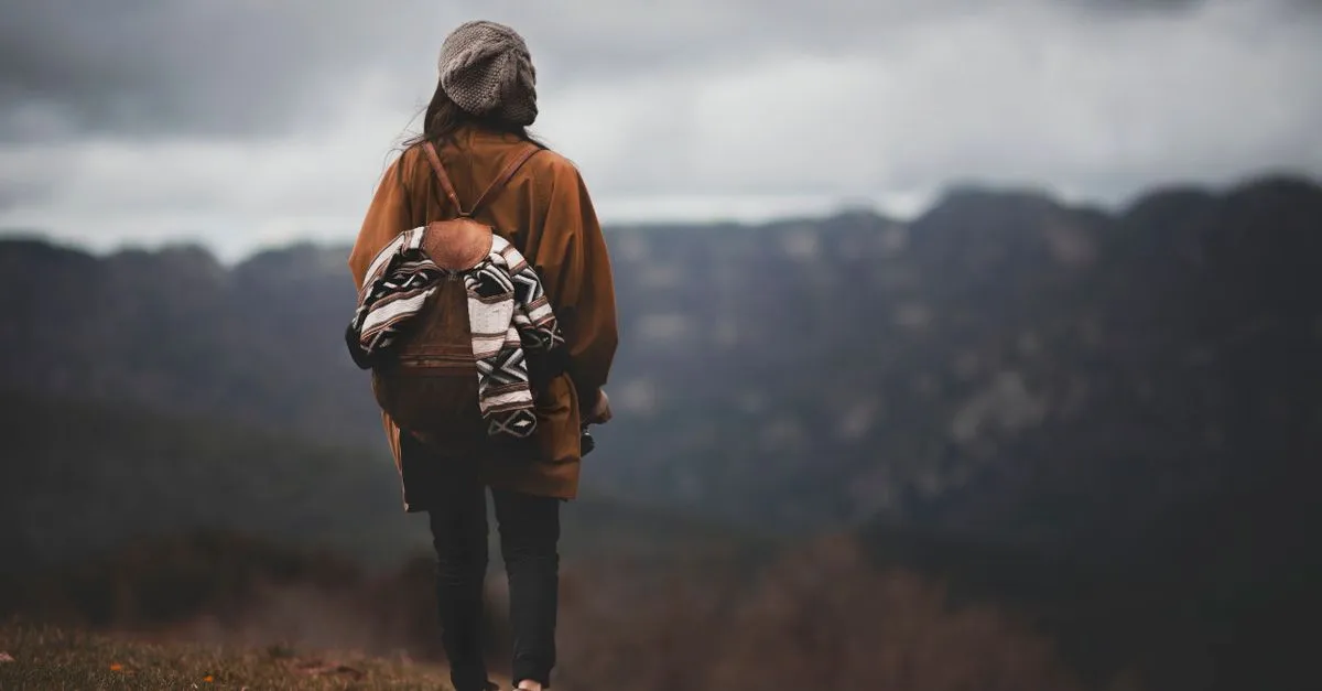 Solo female traveler enjoying a scenic view