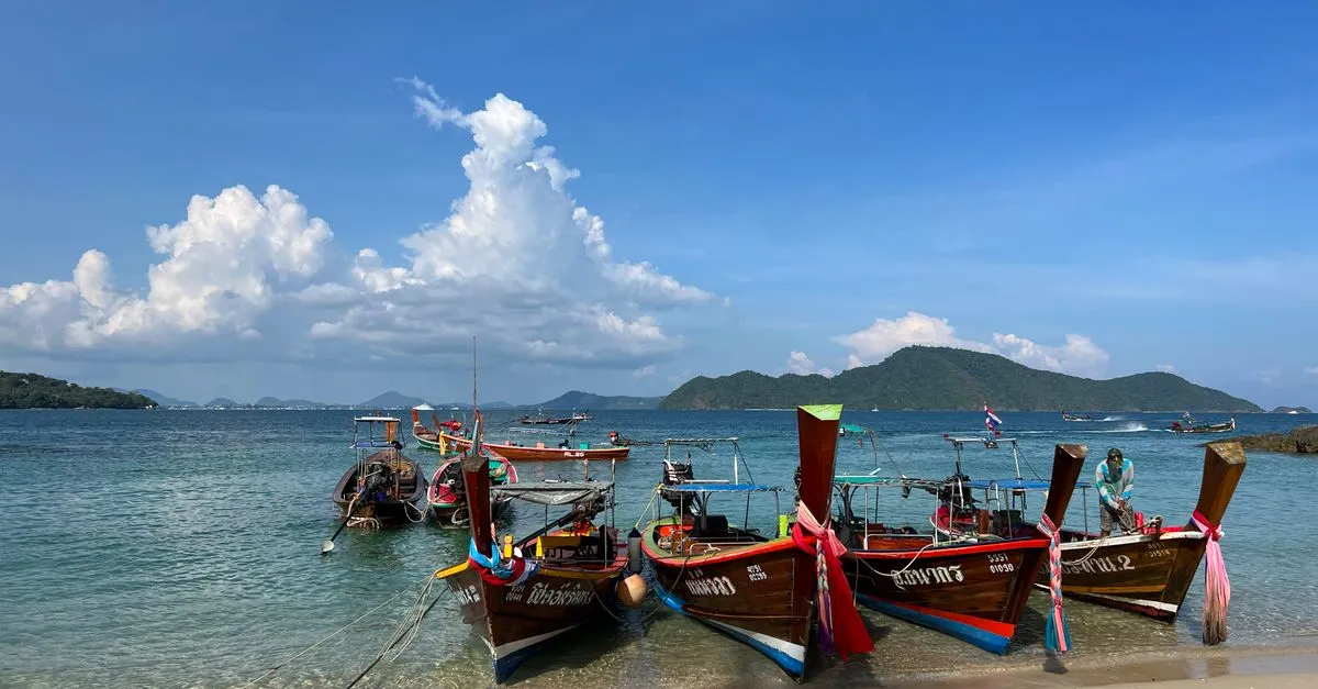 Andaman Sea beach with a longtail boat