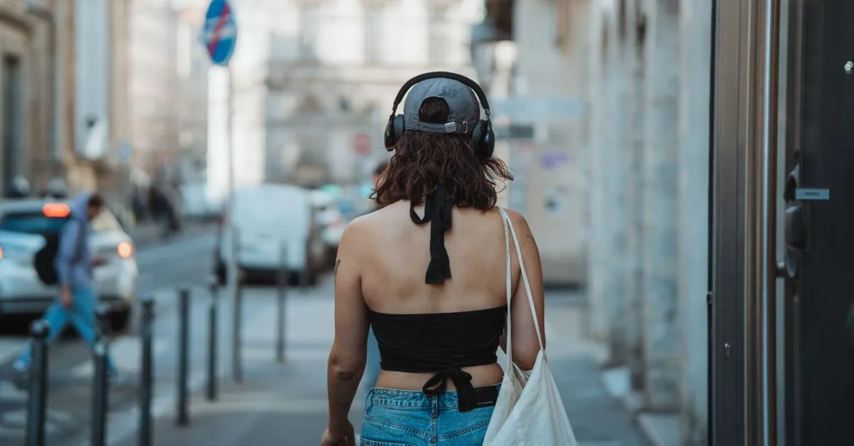 Solo female traveler walking in a night market
