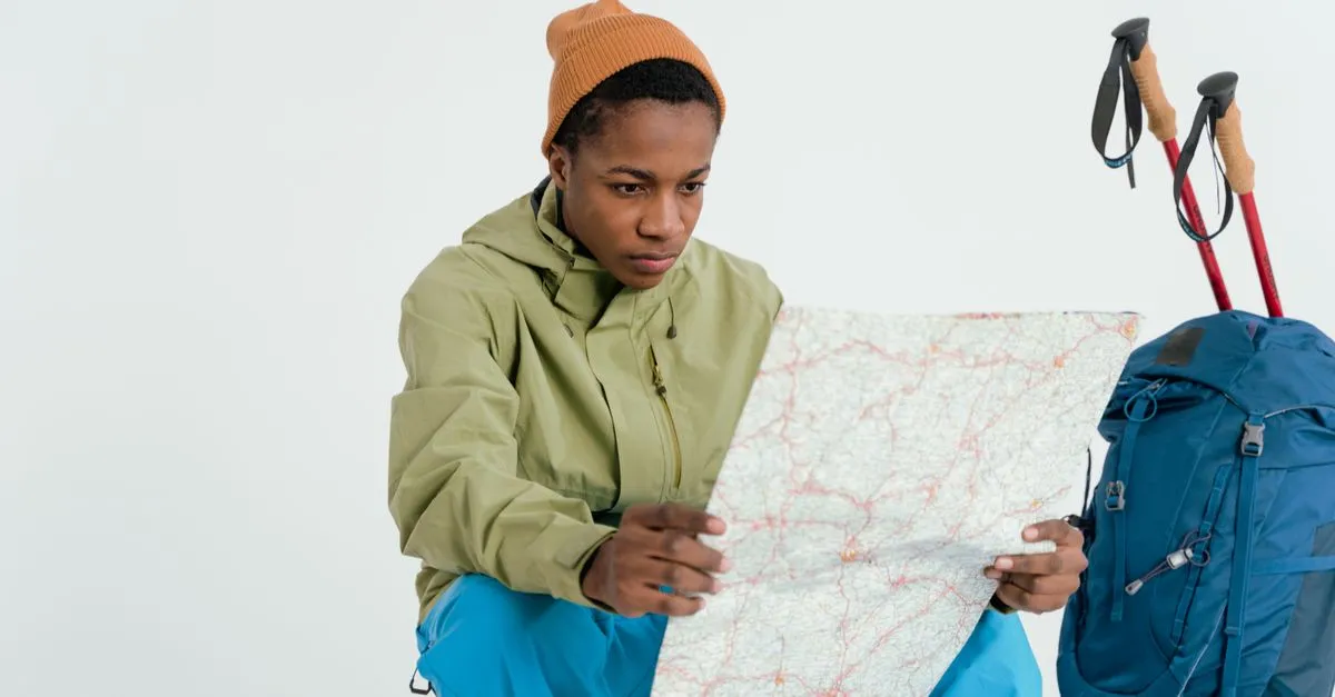 Solo traveler looking at a map